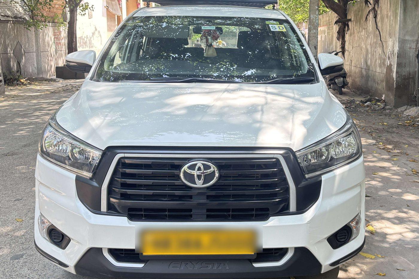 Our white Toyota Innova Crysta, photographed in Jaipur
