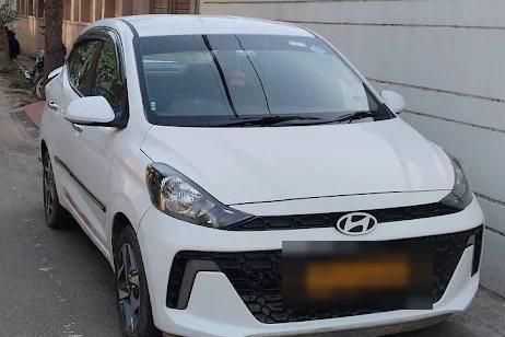 Our white Hyundai Aura, the other sedan we run in this class